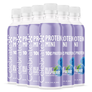 Plusieurs bouteilles de Protéine saveur Mini Blue Raspberry sur fond blanc